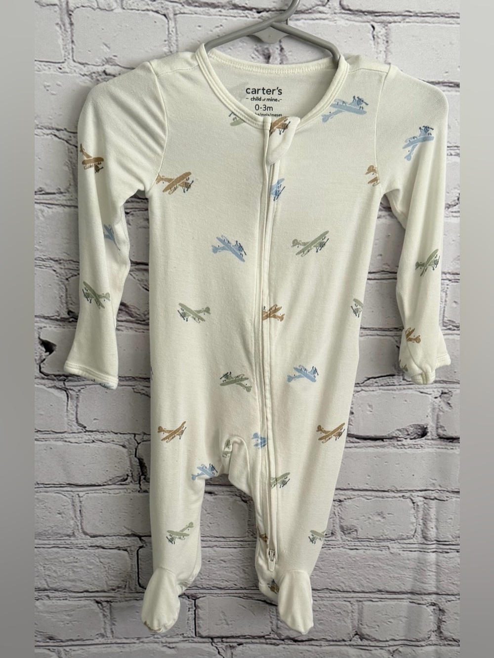 Carter's Cream Footed Pajamas with Blue, Green & Tan Airplane Print